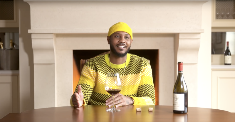 Carmelo Anthony with a bottle of wine